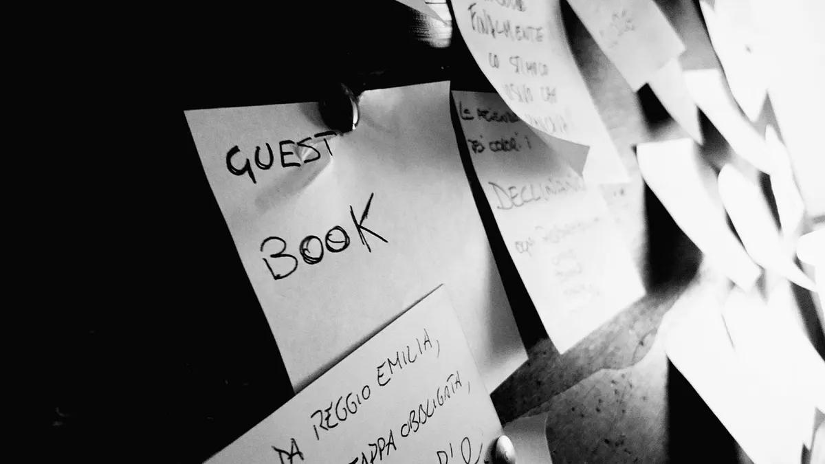 Handwritten paper notes pinned to a cork board, like the many short text notes a domain keeps in its TXT records.