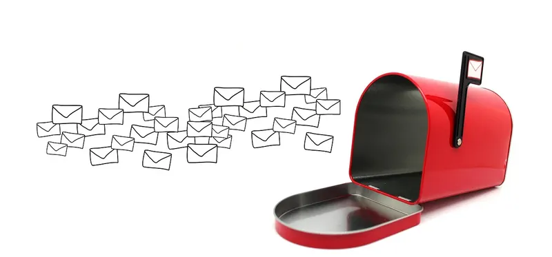 Open red mailbox with a stream of envelopes flying away from it, like email going astray