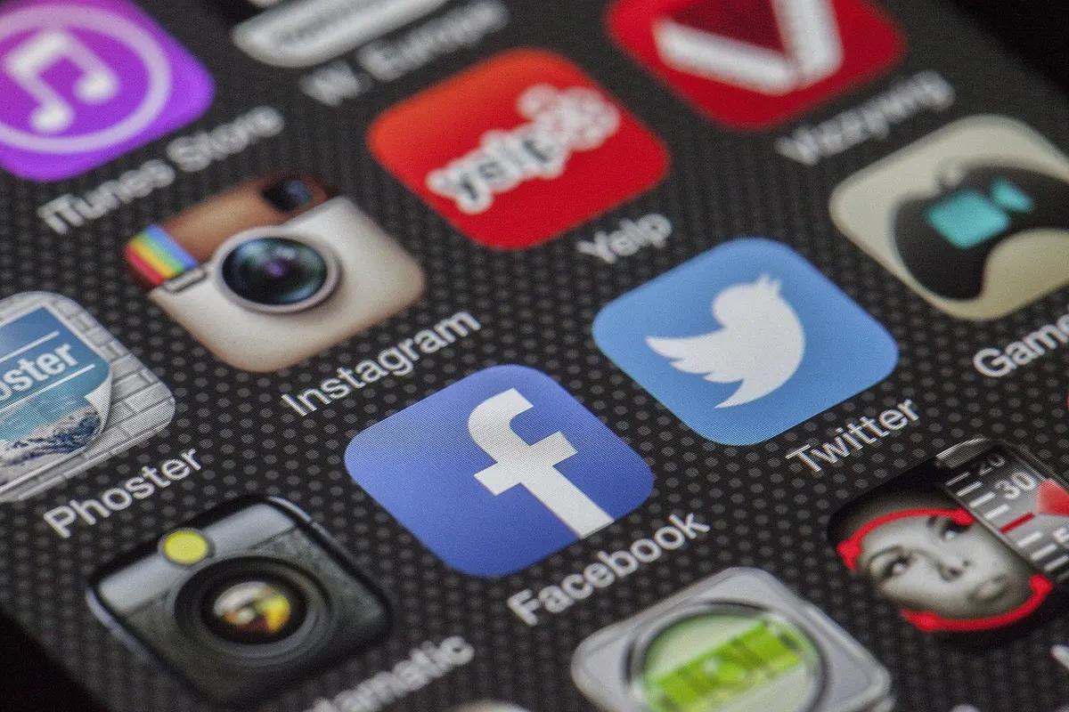 Close-up of colourful app icons on a smartphone screen, the same kind of tiny square brand mark a favicon gives your website.