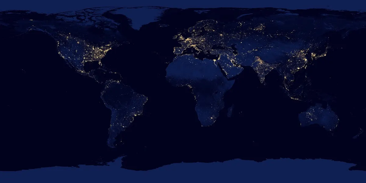 A satellite-style map of the Earth at night with city lights scattered across every continent, like the locations a CDN serves files from.